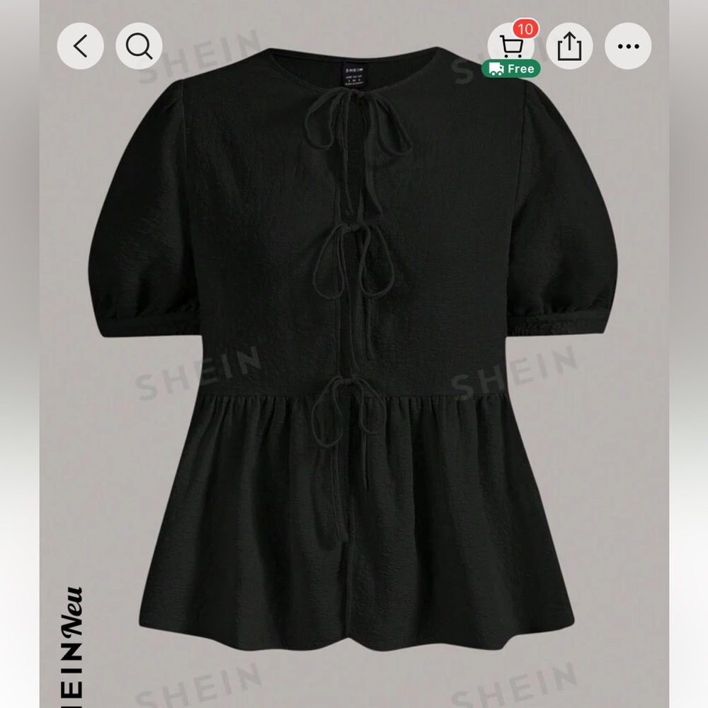 New black and super cute top size Large. Never used (it doesnt fit me)